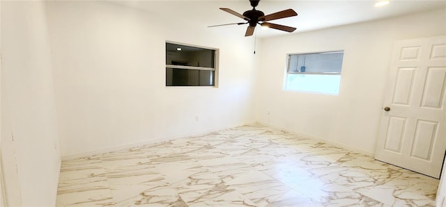 3372 Elkcam Blvd, Port Charlotte, FL 33952 - empty room with recessed lighting, marble finish floor, baseboards, and ceiling fan