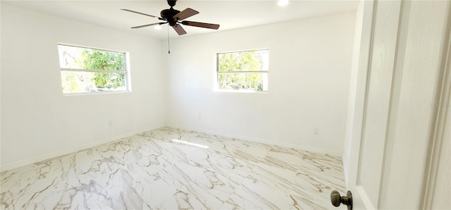 3372 Elkcam Blvd, Port Charlotte, FL 33952 - spare room with a ceiling fan, baseboards, and marble finish floor