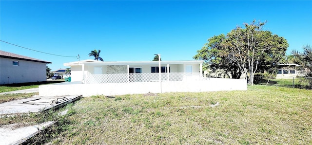 3372 Elkcam Blvd, Port Charlotte, FL 33952 - rear view of property with a lawn and fence