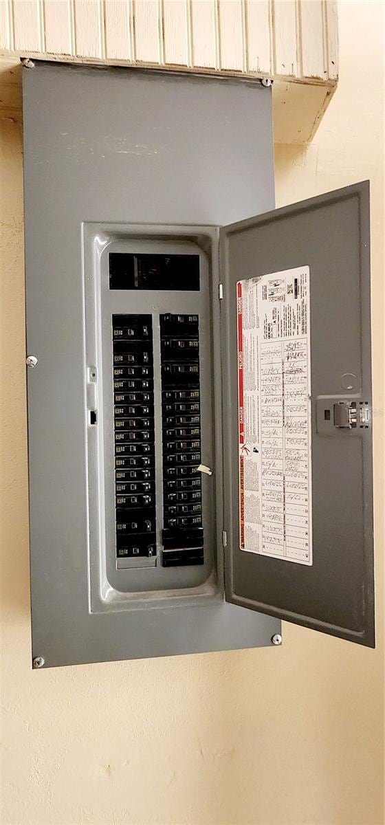 3372 Elkcam Blvd, Port Charlotte, FL 33952 - utility room featuring electric panel