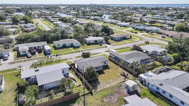 bird's eye view featuring a residential view and a water view