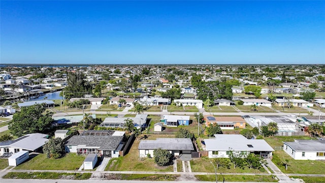 aerial view featuring a residential view and a water view