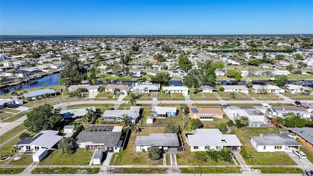 bird's eye view featuring a residential view and a water view