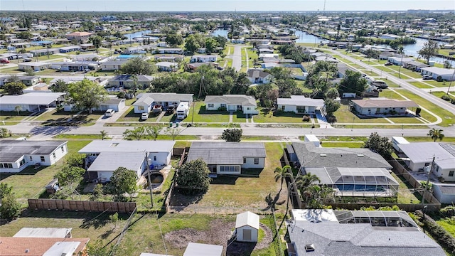 birds eye view of property with a water view and a residential view