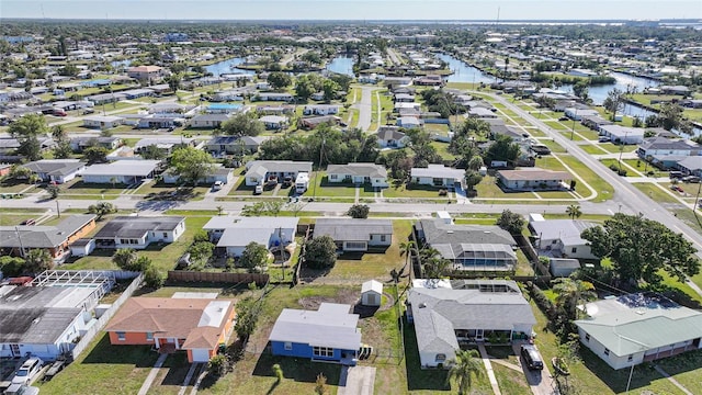 birds eye view of property featuring a residential view and a water view