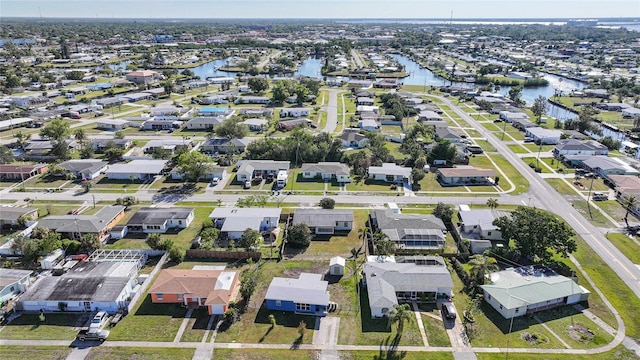 birds eye view of property featuring a residential view and a water view