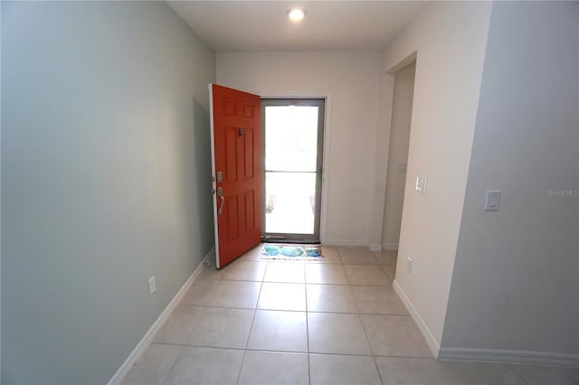 entrance foyer with baseboards and light tile patterned flooring