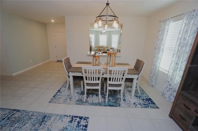 dining room with light tile patterned floors, recessed lighting, an inviting chandelier, and baseboards