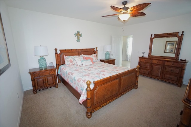 bedroom featuring a ceiling fan, baseboards, and light carpet
