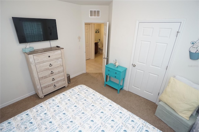 carpeted bedroom with visible vents and baseboards