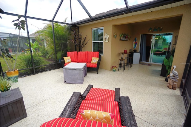 view of patio with glass enclosure