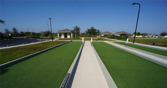 surrounding community featuring a yard