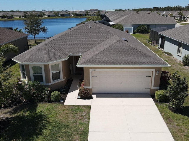 ranch-style house with a shingled roof, a residential view, concrete driveway, stucco siding, and an attached garage