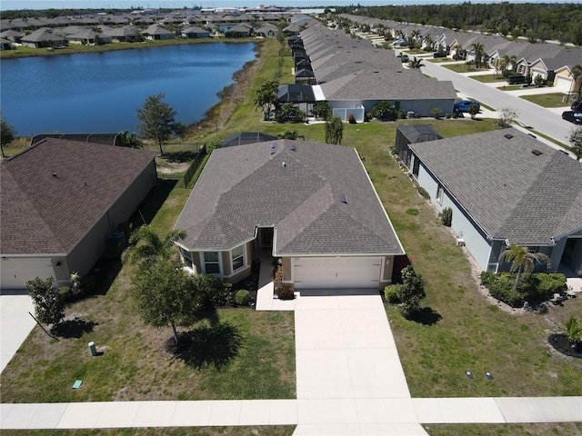 aerial view with a residential view and a water view