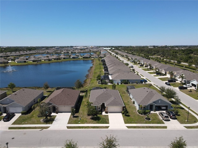 aerial view with a residential view and a water view