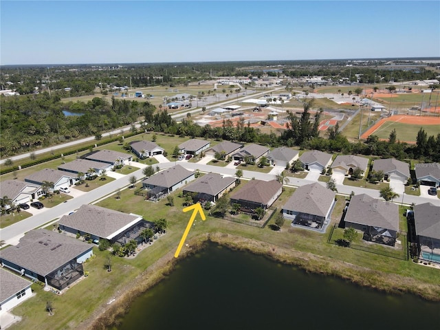 birds eye view of property featuring a residential view and a water view