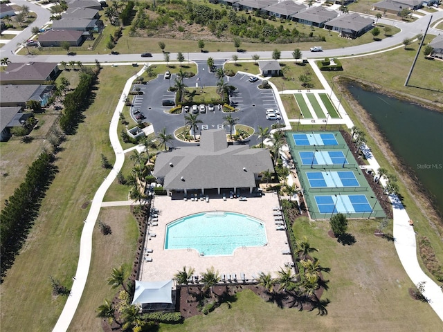 birds eye view of property featuring a residential view and a water view
