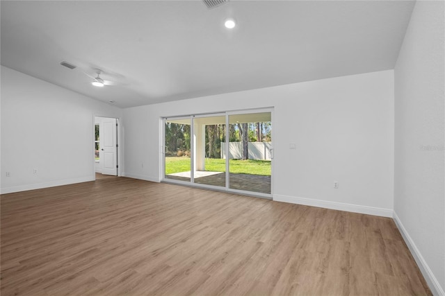 spare room with visible vents, ceiling fan, baseboards, and light wood-style floors