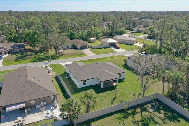 bird's eye view with a residential view and a view of trees