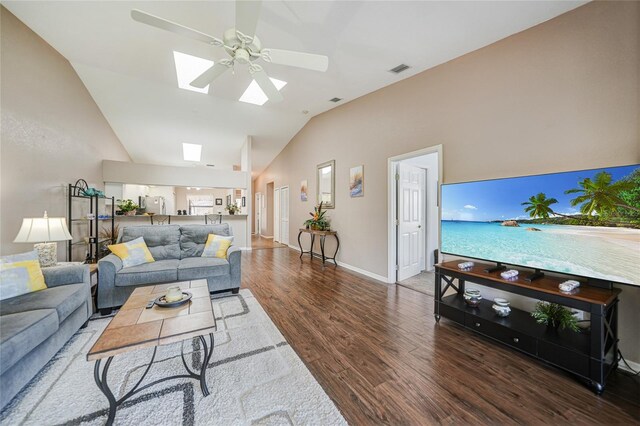 5036 San Rocco Ct, Punta Gorda, FL 33950 - living area featuring wood finished floors, baseboards, visible vents, a skylight, and ceiling fan