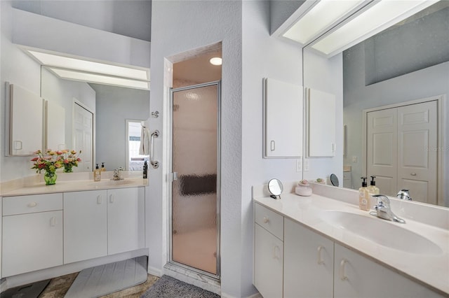 5036 San Rocco Ct, Punta Gorda, FL 33950 - full bathroom with a shower stall, two vanities, and a sink