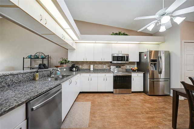 5036 San Rocco Ct, Punta Gorda, FL 33950 - kitchen featuring backsplash, vaulted ceiling, appliances with stainless steel finishes, a ceiling fan, and a sink
