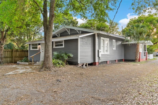 back of property featuring fence