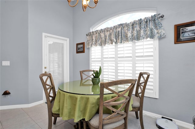 1701 Lastingham Ln, Port Charlotte, FL 33980 - dining space featuring tile patterned flooring, a notable chandelier, and baseboards