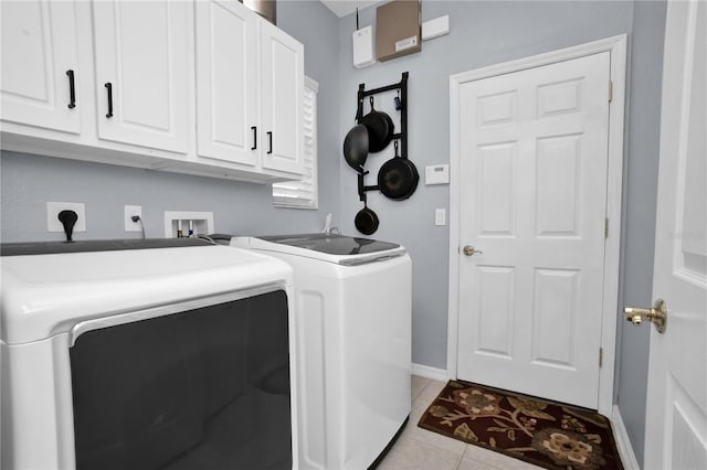 1701 Lastingham Ln, Port Charlotte, FL 33980 - washroom with washer and dryer, light tile patterned floors, cabinet space, and baseboards