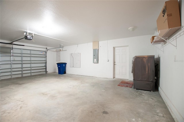 garage with electric panel and a garage door opener