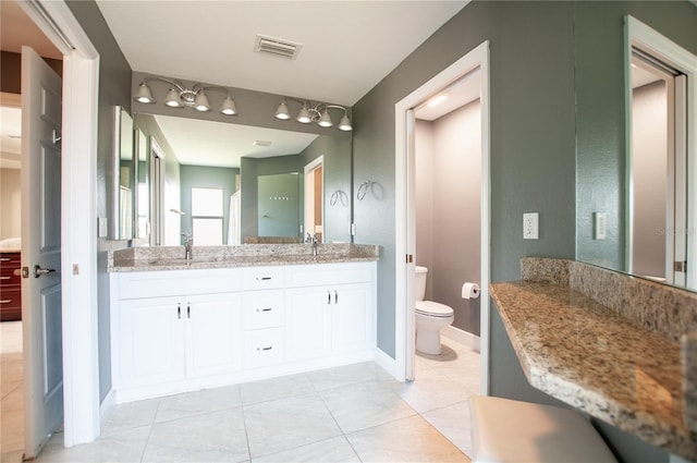 full bathroom with tile patterned floors, visible vents, toilet, a sink, and double vanity