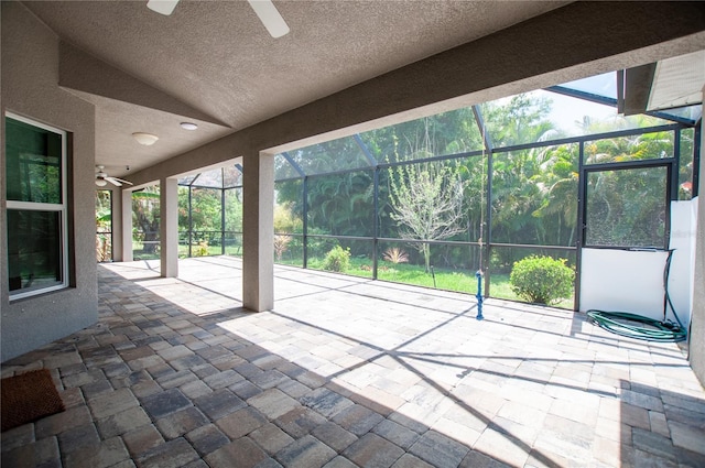 view of patio / terrace with a lanai and a ceiling fan