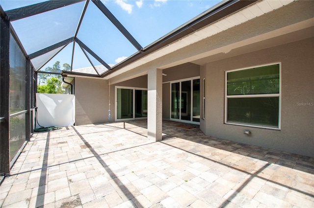 unfurnished sunroom featuring vaulted ceiling