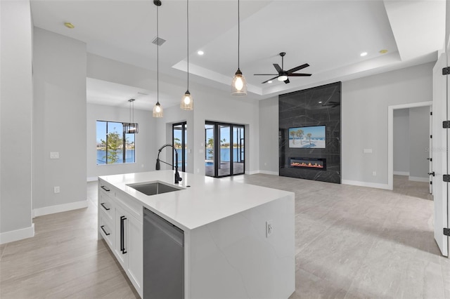 2716 SW 13th Ave, Cape Coral, FL 33914 - kitchen with a sink, a raised ceiling, dishwasher, and a ceiling fan