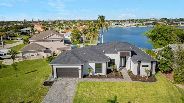 2716 SW 13th Ave, Cape Coral, FL 33914 - view of front of home with an attached garage, a residential view, driveway, and stucco siding