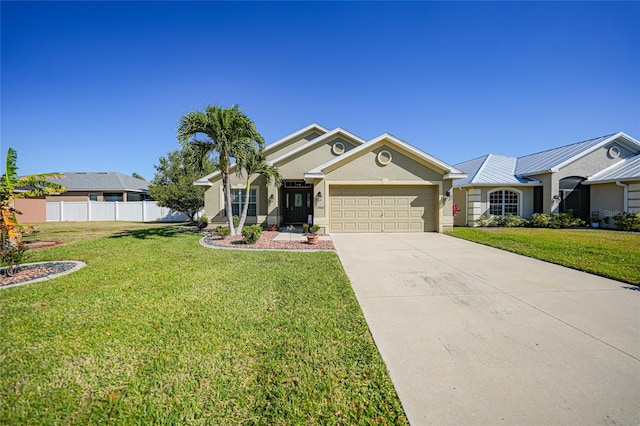 ranch-style home featuring a front lawn, fence, concrete driveway, stucco siding, and a garage