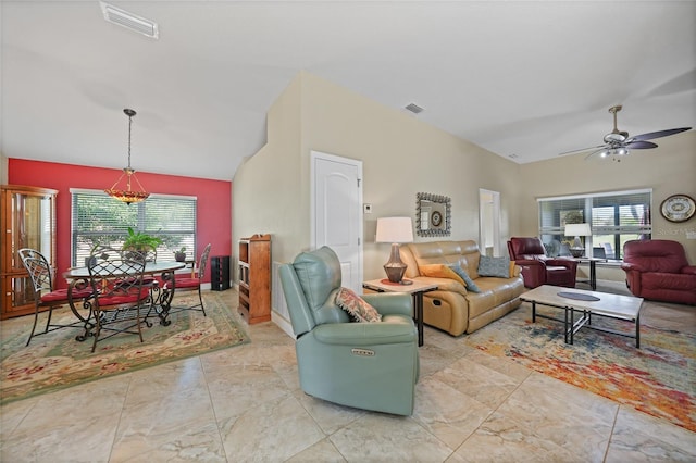 living area featuring visible vents, lofted ceiling, and ceiling fan