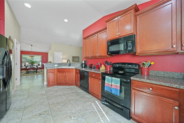 kitchen with lofted ceiling, a peninsula, brown cabinetry, black appliances, and a sink
