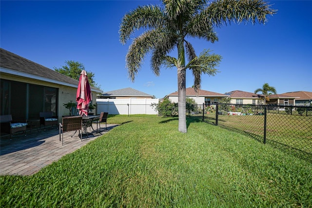 view of yard featuring a fenced backyard and a patio area