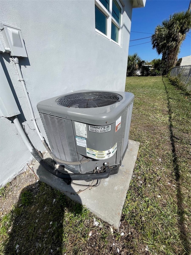 exterior details featuring cooling unit and stucco siding