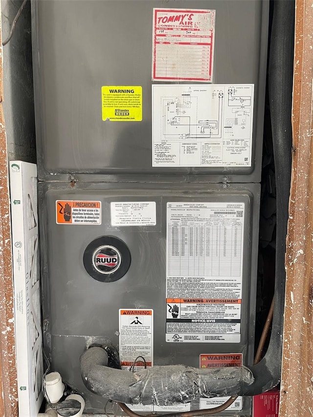 utility room with heating unit