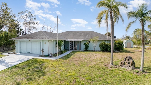 535 Ramblewood St, Port Charlotte, FL 33953 - ranch-style house with concrete driveway, stucco siding, a storage unit, a front lawn, and a garage