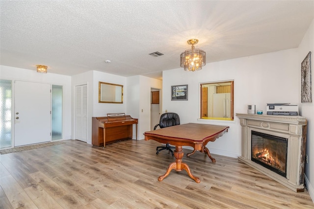 535 Ramblewood St, Port Charlotte, FL 33953 - office space featuring visible vents, a textured ceiling, and light wood-type flooring