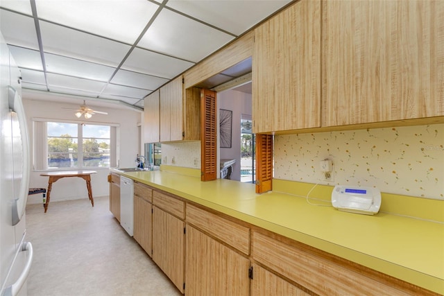 535 Ramblewood St, Port Charlotte, FL 33953 - kitchen featuring light countertops, a sink, white appliances, wallpapered walls, and ceiling fan