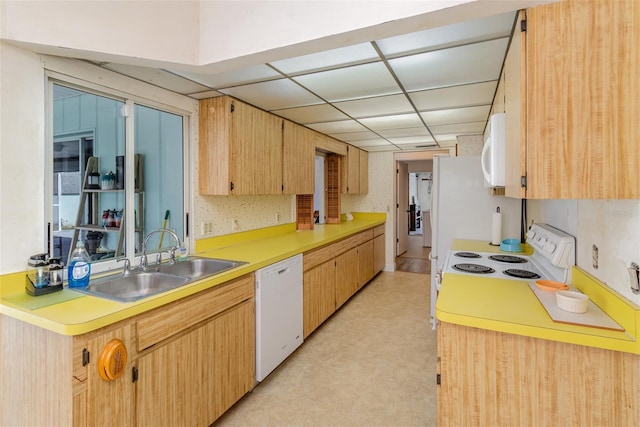 535 Ramblewood St, Port Charlotte, FL 33953 - kitchen with light countertops, white appliances, a sink, light brown cabinets, and a paneled ceiling