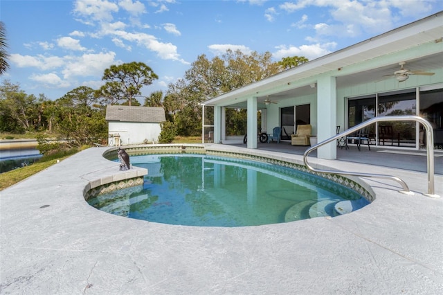 535 Ramblewood St, Port Charlotte, FL 33953 - outdoor pool with a ceiling fan, an outbuilding, a storage shed, and a patio area