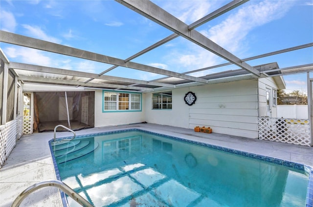 outdoor pool featuring a lanai and a patio area