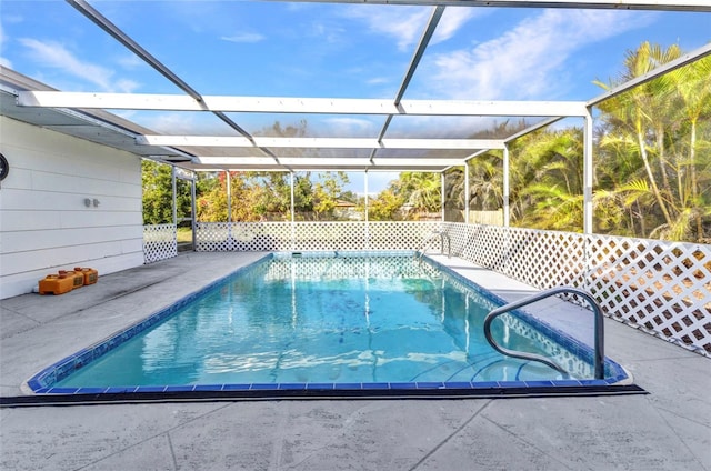 pool featuring a lanai and a patio area