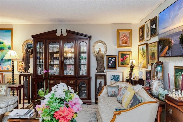 105 Clubhouse Dr Unit D155, Naples, FL 34105 - carpeted living area with a textured ceiling and ornamental molding