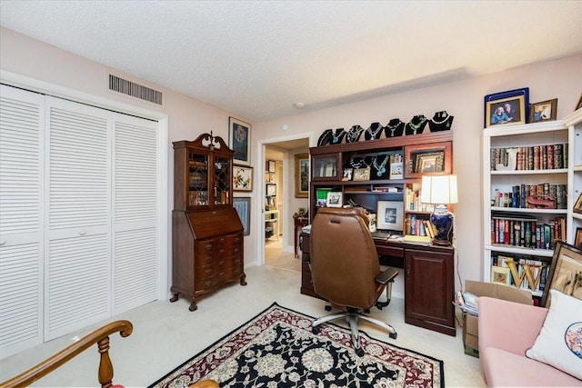 105 Clubhouse Dr Unit D155, Naples, FL 34105 - home office featuring visible vents, a textured ceiling, and light colored carpet